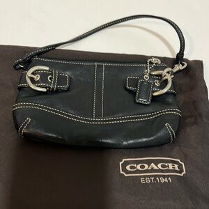 Coach black leather wristlet handbag.